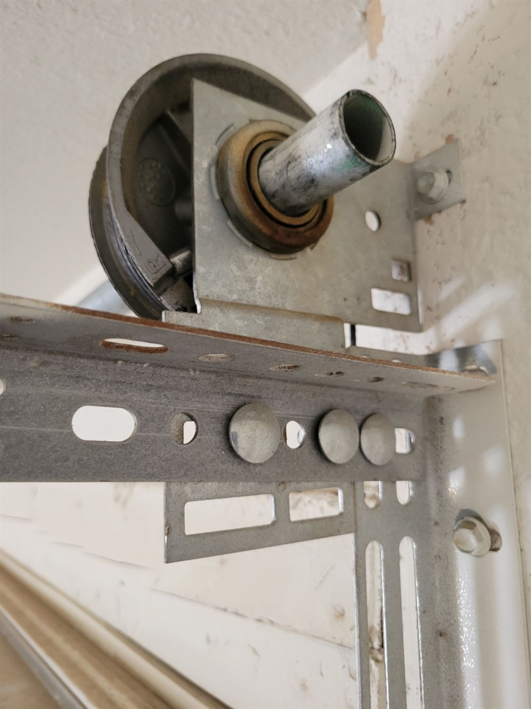Garage door cable drum and end bearing checked during spring replacement
